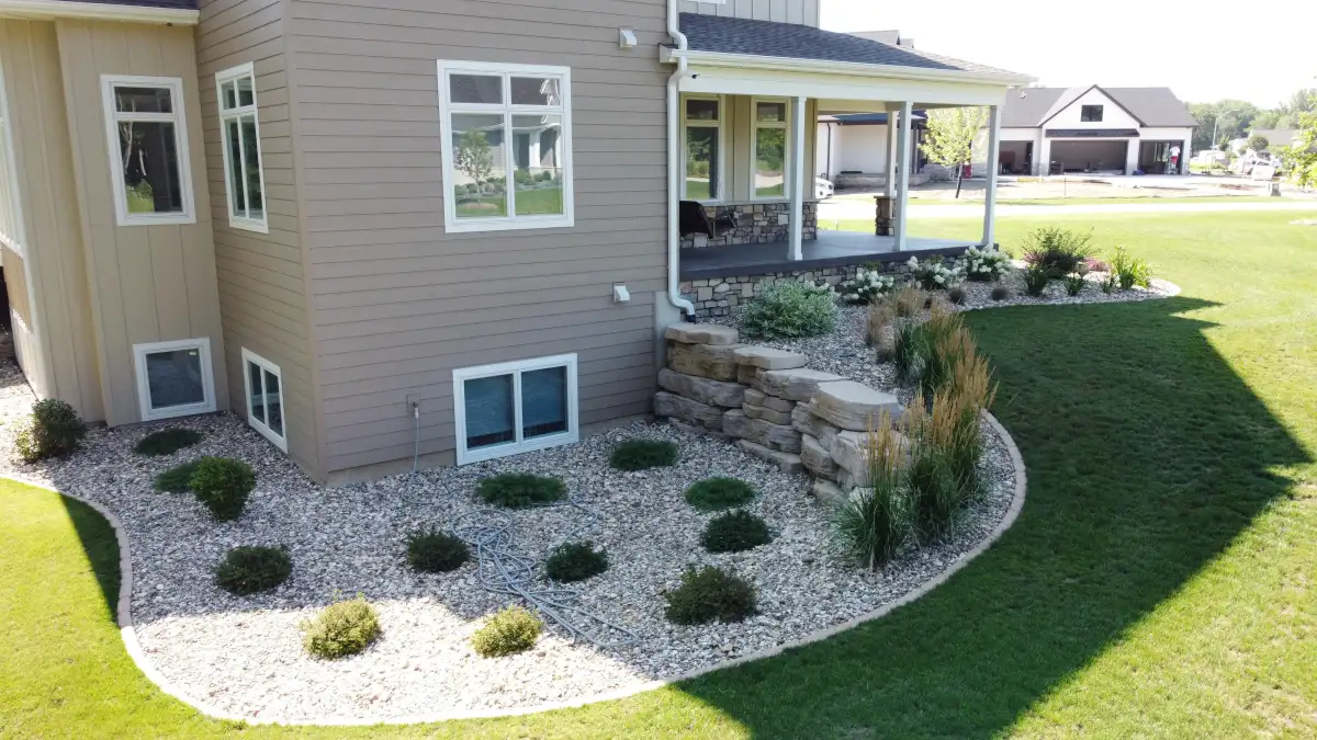 Commercial building with natural stone retaining wall along street